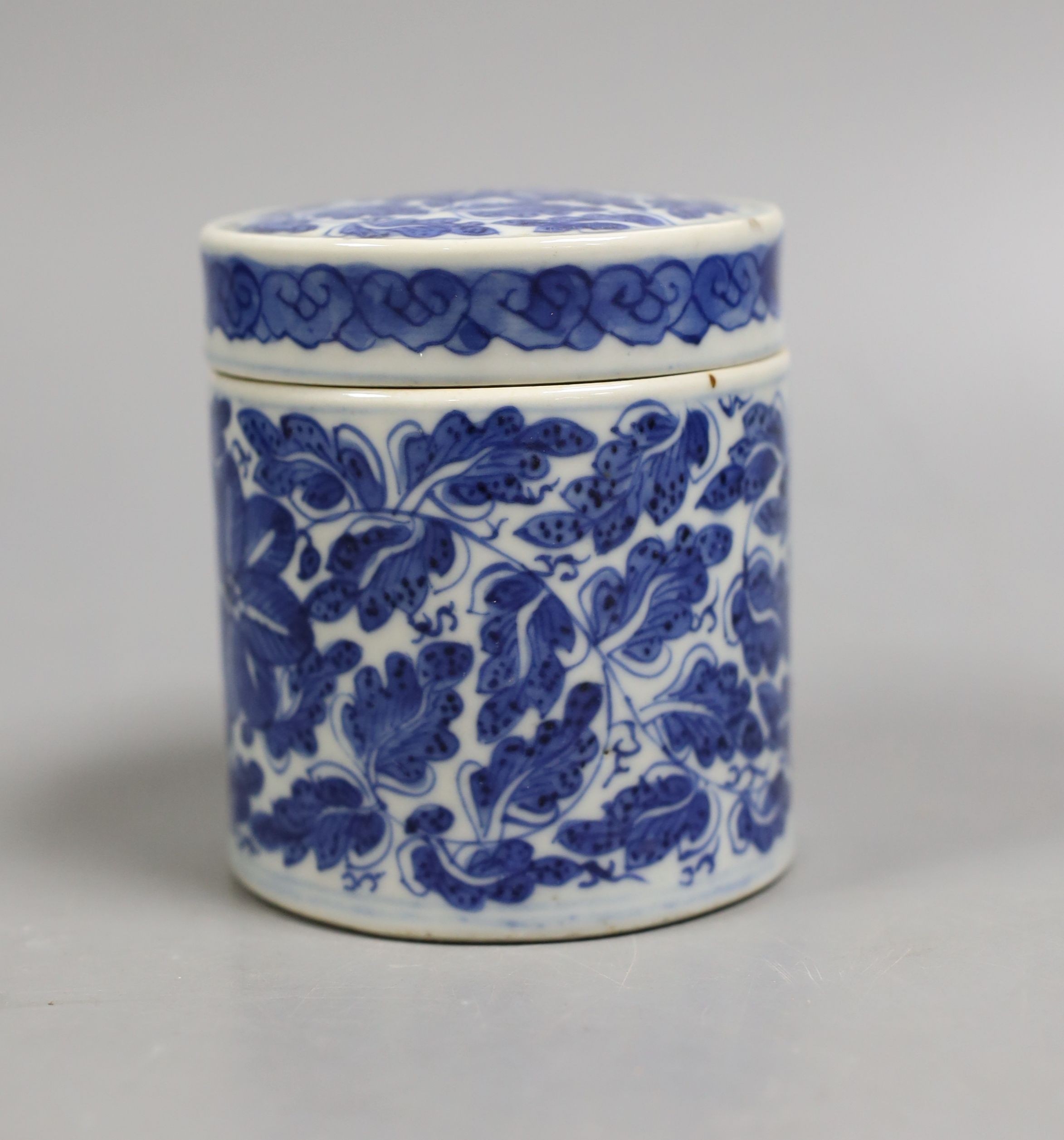 A 19th century Chinese blue and white pot and cover, 9 cms high.